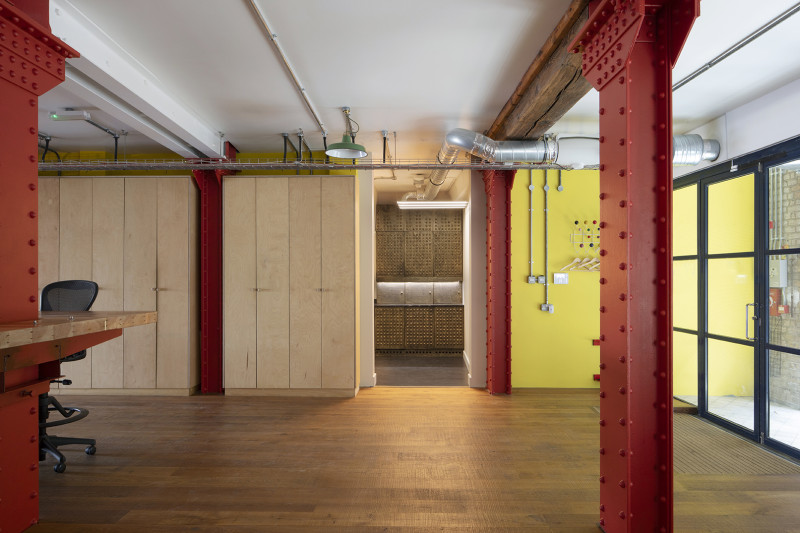 Office in Shad Thames, view from the main space towards the kitchenette/ bar space, created by Heckmann Design